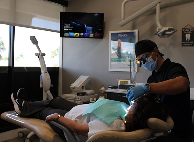 Dentist treating a dental patient