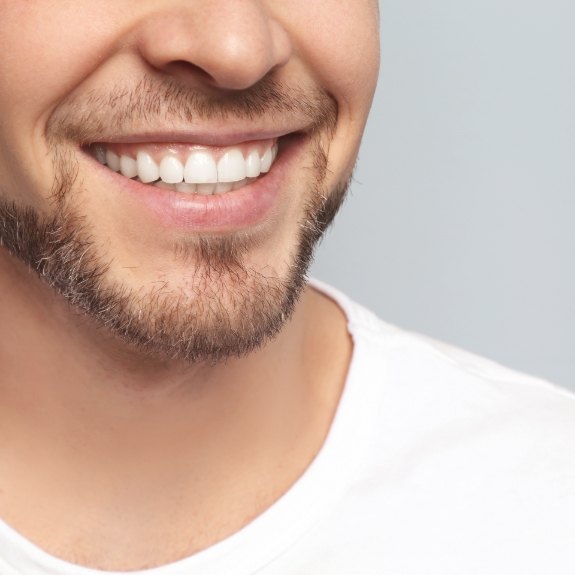 Close up of smiling man with short beard