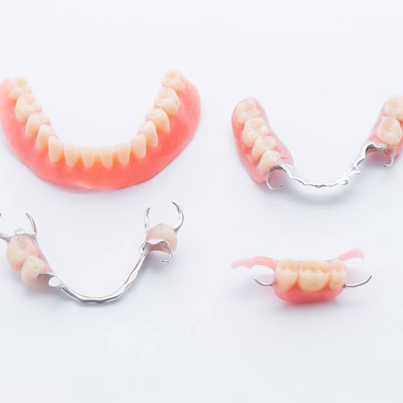 Full and partial dentures against neutral background