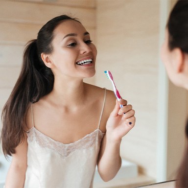 Woman holding a toothbrush