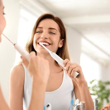 Woman brushing her teeth